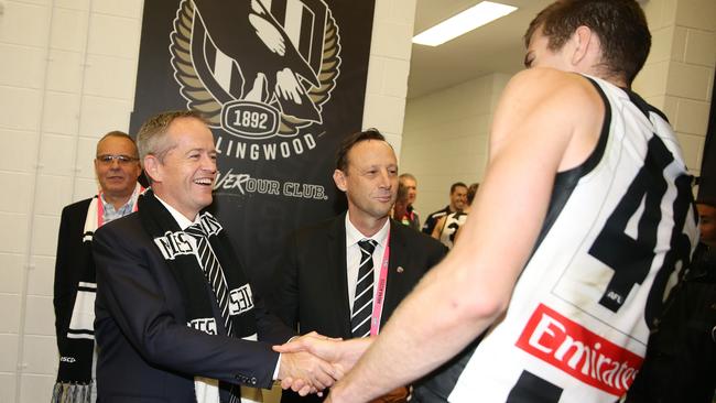 Mason Cox meets Labor leader Bill Shorten in the Magpies rooms after the match. Picture: Michael Klein