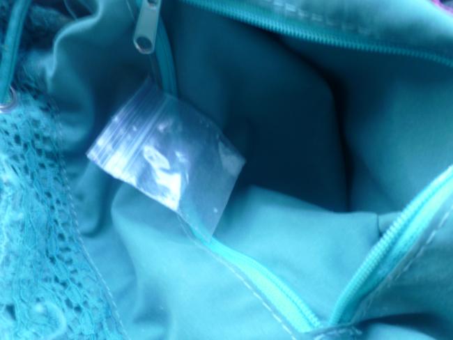 During the Silverwater search, a small clear bag with white crystal substance believed to be ice was located in a woman's handbag. NSW Police attended and issued a Field Court Attendance Notice.