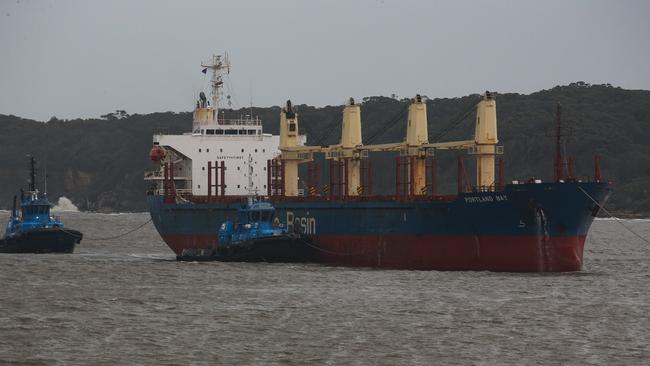 Tug boats assist the bulk carrier into Botany Bay on Wednesday. Picture: Gaye Gerard