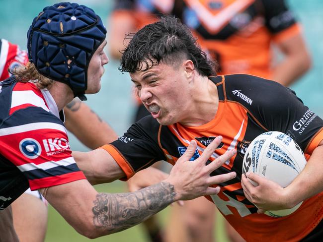 Cooper Rauhihi runs into Roosters player Jackson Pennell. Picture: Julian Andrews