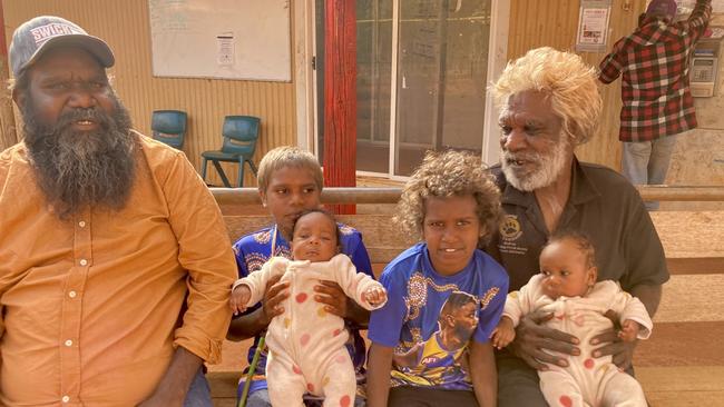 Martu man Melvin Farmer (left) with family in Kunawarritji, Western Australia.