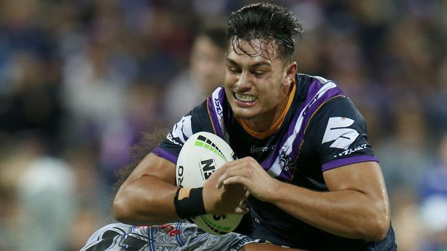 Tino Fa'asuamaleaui carries the ball during a Melbourne Storm trial game against NZ Warriors in February. Picture: Darrian Traynor