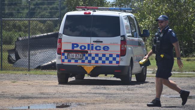 Police investigate the scene on the banks of the Burnett River and interview boaties following a serious boat crash.