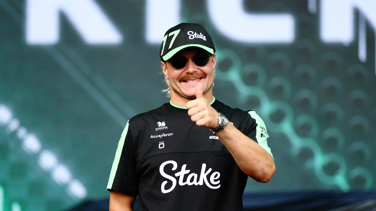 SINGAPORE, SINGAPORE - SEPTEMBER 20: Valtteri Bottas of Finland and Stake F1 Team Kick Sauber talks to the crowd on the fan stage prior to practice ahead of the F1 Grand Prix of Singapore at Marina Bay Street Circuit on September 20, 2024 in Singapore, Singapore. (Photo by Lars Baron - Formula 1/Formula 1 via Getty Images)