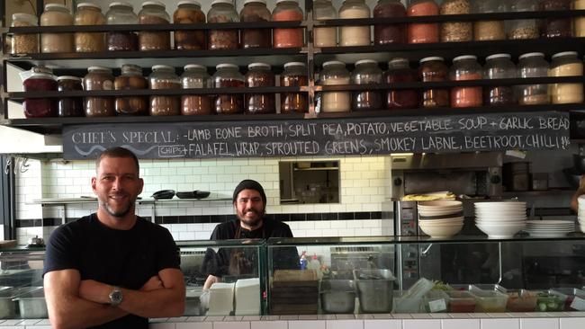 Co-owner Yoni Kalfus with chef German Sanchez and Shuk’s distinctive jars.