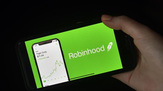 This photo illustration shows the logo of trading application Robinhood on a mobile phone in Arlington, Virginia on January 28, 2021. (Photo by Olivier DOULIERY / AFP)