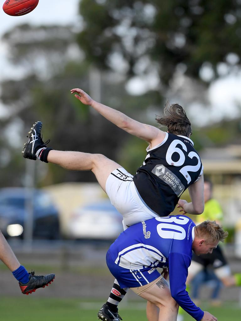 Essendon District: Moonee Valley’&#149;s Luke Egan tumbles over Coburg Districts opponent&#149; Nicholas Heales. Picture: Andy Brownbill