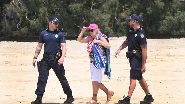 Black Swan Lake protest at Bundall goes to another level, with protesters chaining themselves to the fence and then getting themselves arrested after running onto the worksite and stopping the trucks. Protester Lindy Donato stopped the trucks after wandering onto the worksite, before being escorted to the Paddy wagon. Picture Glenn Hampson