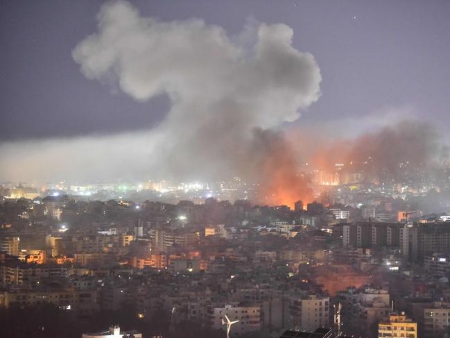 TOPSHOT - Smoke rises from the site of an Israeli airstrike that targeted a neighborhood in Beirutâs southern suburb on October 3, 2024. The Israeli military issued orders in the early hours of October 3, telling people to leave multiple areas of densely-populated southern Beirut, where it says it will hit Hezbollah sites. "You are located near facilities and interests belonging to Hezbollah, which the army will act against in the near future," Israeli military spokesman Avichay Adraee said in a post on social media site X, naming the Haret Hreik, Burj al-Barajneh and Hadath Gharb areas. (Photo by Fadel ITANI / AFP)