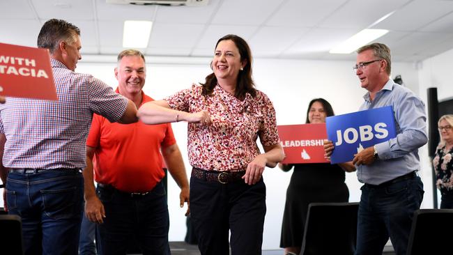 TOWNSVILLE, AUSTRALIA – NewsWire Photos – OCTOBER 25, 2020. Queensland Premier Annastacia Palaszczuk bumps elbows with Thuringowa MP Aaron Harper (left), watched by Townsville MP Scott Stewart (centre) and LaborÃ&#149;s candidate for Mundingburra Les Walker during a regional rally campaign event in Townsville. Queenslanders go to the polls on October 31. Picture: NCA NewsWire / Dan Peled