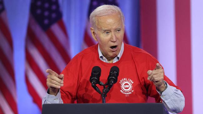 Joe Biden makes his point with car workers at Belvidere, Illinois. Picture: Getty Images