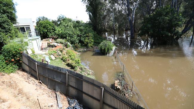 The floods in the backyard of a Wangaratta house. Picture: Alex Coppel.