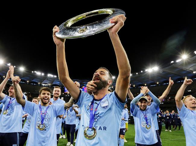 PERTH, AUSTRALIA - MAY 19:  Alex Brosque of Sydney FC holds the trophy aloft for fans after  the 2019 A-League Grand Final match between the Perth Glory and Sydney FC at Optus Stadium on May 19, 2019 in Perth, Australia. (Photo by Will Russell/Getty Images)