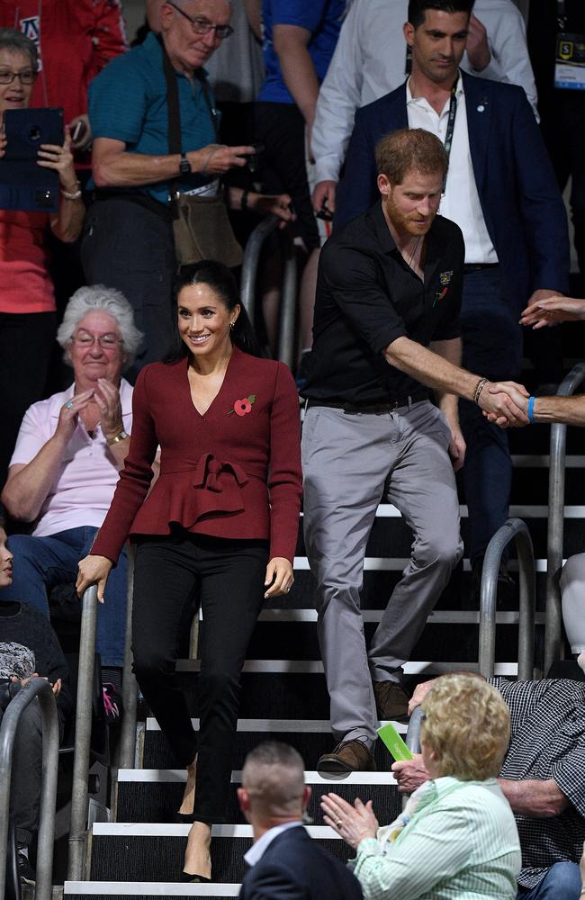 Britain's Prince Harry, the Duke of Sussex and his wife Meghan, the Duchess of Sussex are seen arriving at the Wheelchair Basketball Final at the Invictus Games in Sydney. Picture: AAP