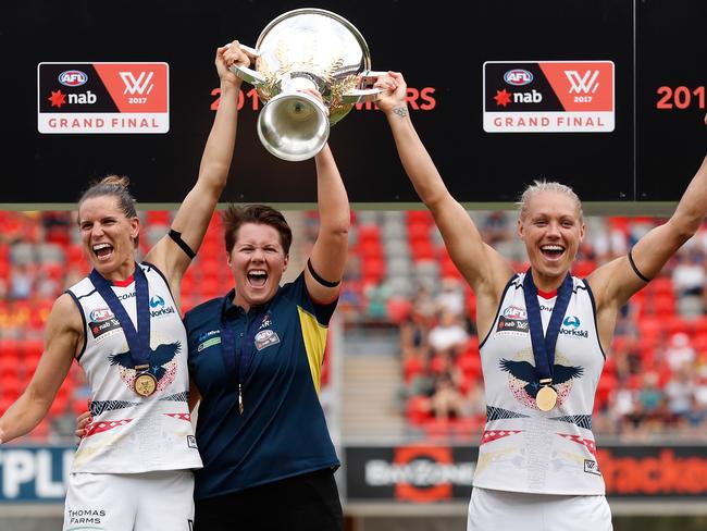 Bec Goddard flanked by Adelaide co-captains Chelsea Randall and Erin Phillips after winning the inaugural AFLW premiership in the Gold Coast earlier this year.