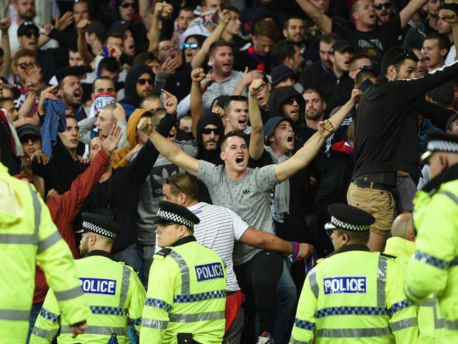 Hajduk Split supporters are held back by police and stewards.