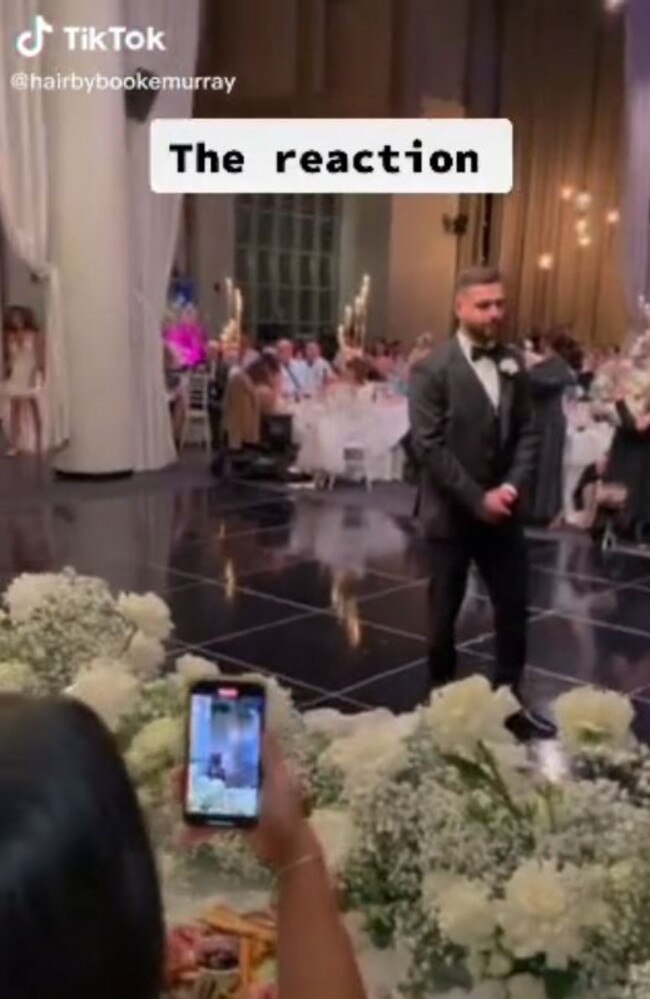 The groom’s reaction was priceless. Picture: TikTok/hairbybrookemurray