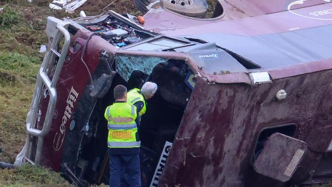 A school bus carrying 32 people has flipped on the Western Highway in Bacchus Marsh on September 21 at 3.15am. Picture: Brendan Beckett