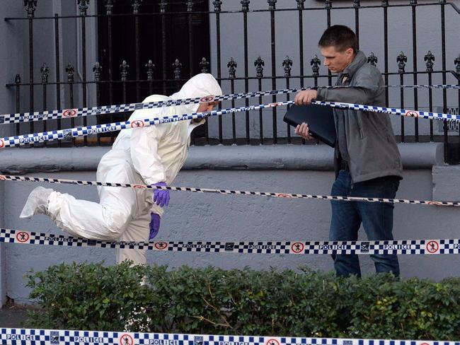 Forensic officers at the Surry Hills property on Sunday. Picture: Jeremy Piper