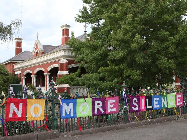 A fence in the main st of Ballarat is covered in signs and ribbons in support of victims of child abuse. The Royal Commission into Institutional Responses to Child Sex Abuse is hearing evidence in Ballarat today. Monday, Feb 22. 2016. picture: David Crosling