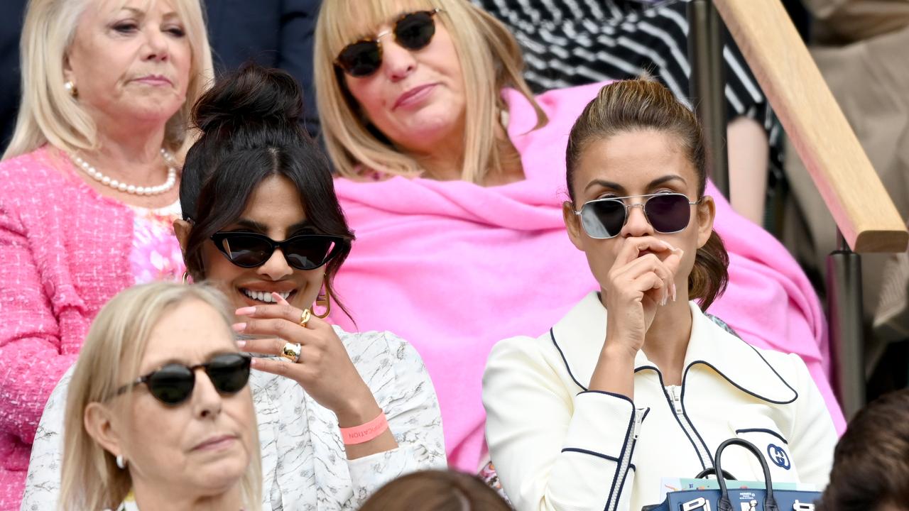 Priyanka Chopra Jonas laughs while sitting with Natasha Poonawalla. (Photo by Karwai Tang/WireImage)