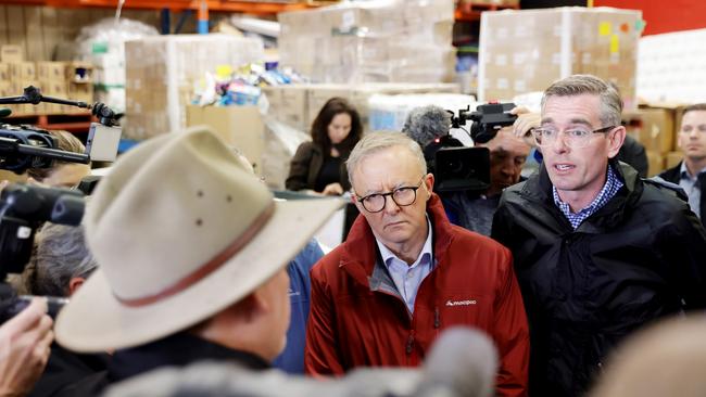 Prime Minister Anthony Albanese and New South Wales Premier Dominic Perrottet talk to flood victims at Hawkesbury. Picture: Jenny Evans