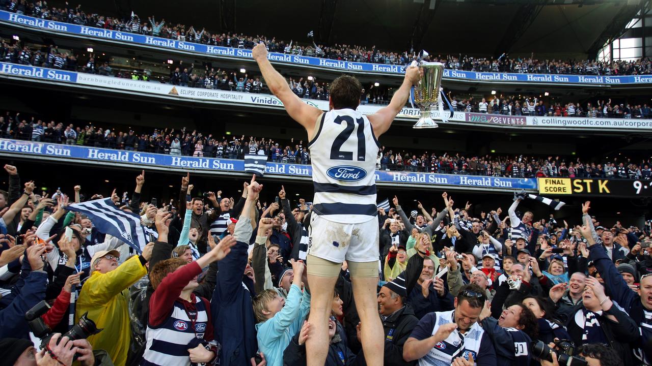 That’s more like it: Mooney celebrates with the crowd after the 2009 grand final win over the Saints.