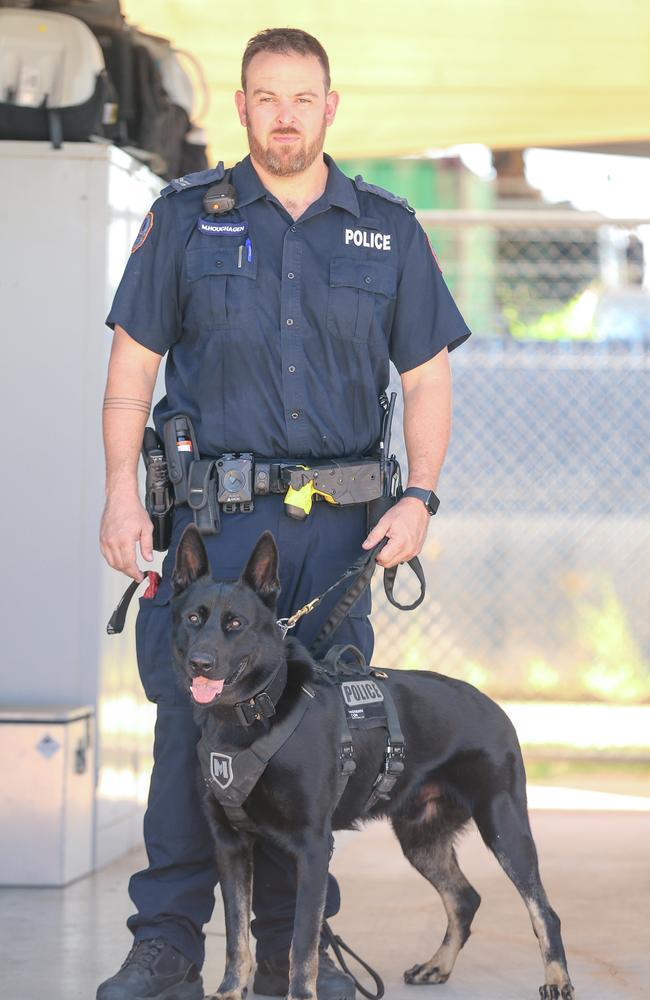 Senior Constable Matthew Houghagen and Daly part of the NT Police Dog Squad. Picture: Glenn Campbell