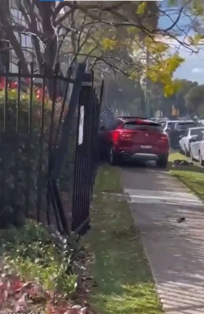 Dramatic footage has recently emerged of an intense citizenâs arrest in south-west Sydney, capturing the moment when furious bystanders confronted an out-of-control driver who had crashed into a fence and a Mercedes on Kylie Parade in Punchbowl. Picture: Twitter/ @SarkySage