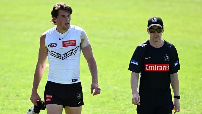 Pat Lipinski of the Magpies walks off the field with an injury. (Photo by Quinn Rooney/Getty Images)