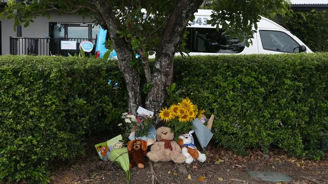 Members of the public left flowers and teddies at the Goodstart Early Learning Centre, Edmonton, following the tragic death of a boy, 3, last February. PICTURE: BRENDAN RADKE