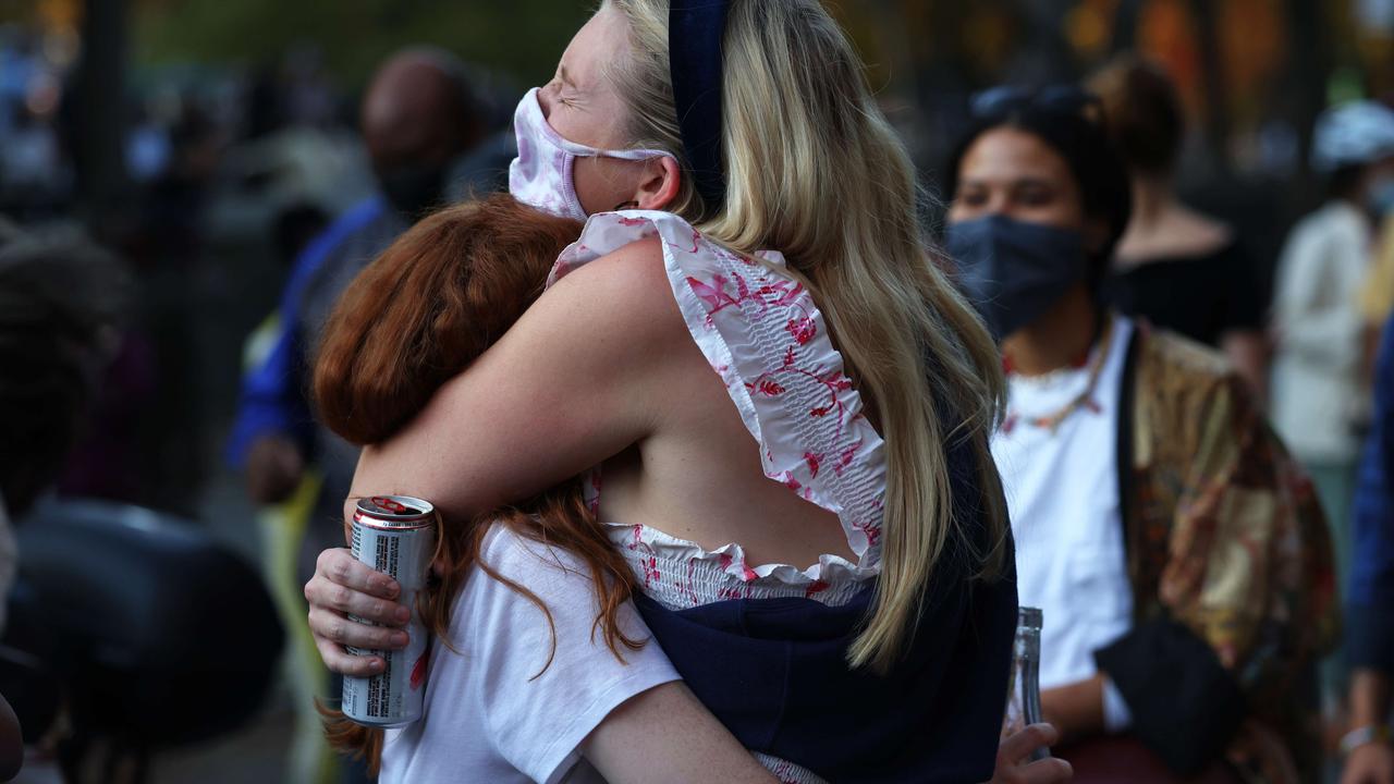 A couple embraces as they celebrate in the Fort Greene neighbourhood of Brooklyn after Joe Biden was declared winner of the 2020 presidential election on November 07, 2020 in New York City. Picture: Michael M. Santiago/Getty Images/AFP