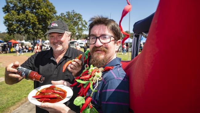 Mark Albert (left) of Childers Fine Foods congratulates Daniel Rose the winner of the Murphys Creek Chilli Carnival chilli chomp eating competition, Sunday, September 18, 2022. Picture: Kevin Farmer