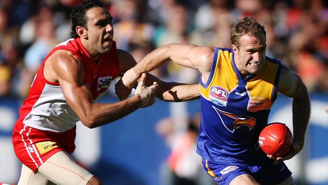 One champion to another: Eagles' Chris Judd breaks clear of Adam Goodes.