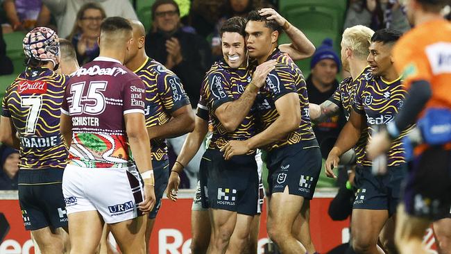 Nick Meaney congratulates Xavier Coates after the winger scored one of Melbourne’s five tries. Picture: Daniel Pockett/Getty Images