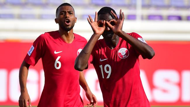 Qatar's forward Almoez Ali (1st-R) during the 2019 AFC Asian Cup group E football match between North Korea and Qatar at the Khalifa bin Zayed stadium in al-Ain on January 13, 2018. (Photo by Giuseppe CACACE / AFP)