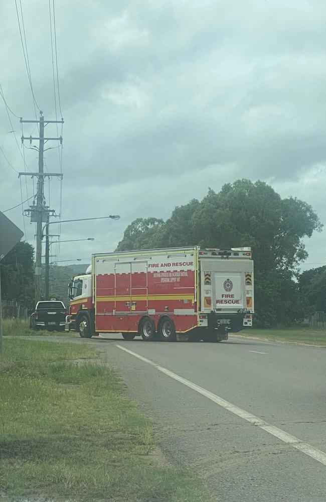 A Queensland Fire Department ‘breathing apparatus and hazardous material operations support unit’ truck arrives on scene.