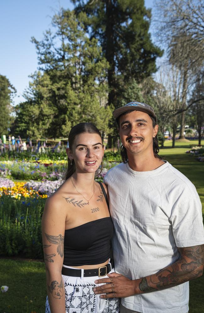 Paris Wiebrecht and Ben Pereira visiting from Perth in Queens Park for Carnival of Flowers, Saturday, September 21, 2024. Picture: Kevin Farmer