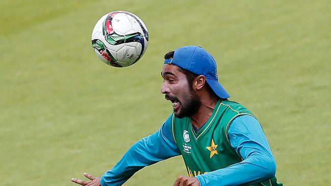 Pakistan's Mohammad Amir plays footbal during a nets practice session at The Oval.