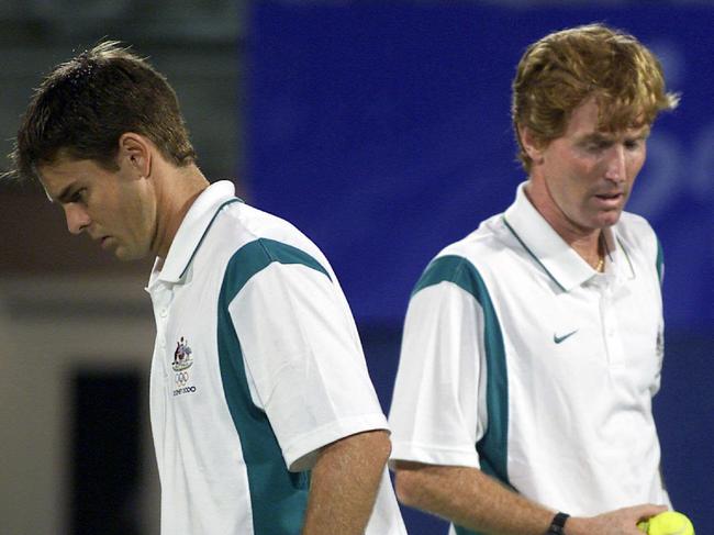 Aust tennis player Todd Woodbridge (l) with Mark Woodforde competing in Australia vs India mens doubles Sydney Olympic Games match 22 Sep 2000. a/ctbhupathi/paes/woodbridge/woodforde/match