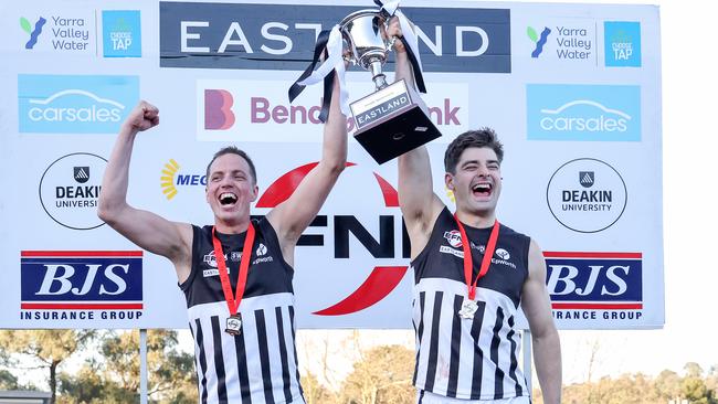 James Kenworthy and Matt Garvin lift the cup, with the win earning Surrey Park promotion to Division 3. The club’s reserves also contested a grand final on Sunday. Picture: George Sal