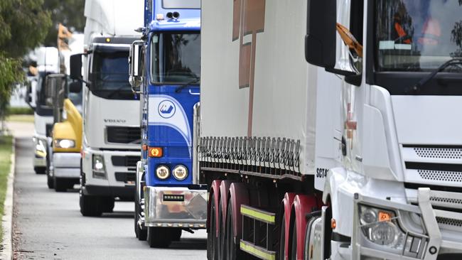 CANBERRA, AUSTRALIA, NewsWire Photos. NOVEMBER 25, 2023: TWU Members and supporters gather in front of Parliament House in Canberra. National truck convoys urge passing of reform as insolvencies soar and 2023 truck crash deaths exceed 200. Picture: NCA NewsWire / Martin Ollman