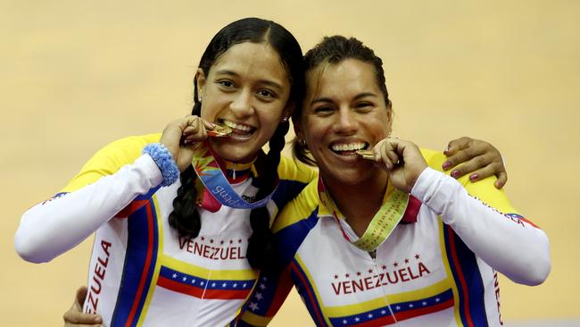 Larreal (right) with Mariestela Vilera after their victory in the Women's Team Sprint Final at the XVI Pan American Games in 2011. Photo by Scott Heavey/Getty Images