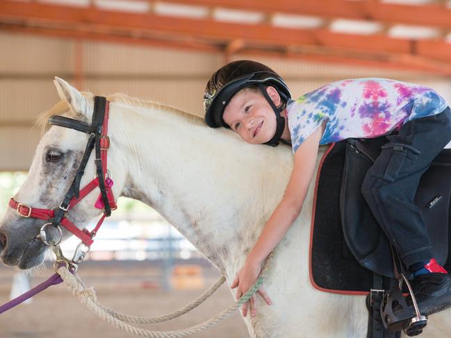 Max Lenoir 8 with Kev the pony at riding for the disabled.Picture GLENN CAMPBELL