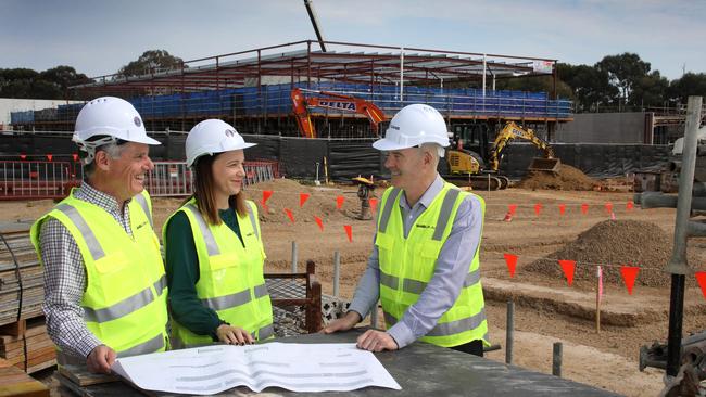 Managing director Andy Keough (R), with Head of Autonomous Systems, SAAB Australia, Rebecca Brickhill, and Dave Symonds, General Manager of the Maritime division of SAAB Australia, at the Mawson Lakes construction site. Picture: Dean Martin