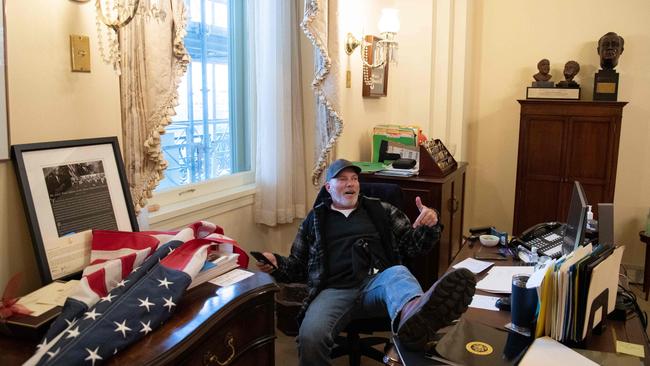 Richard Barnett sits inside the office of Nancy Pelosi as he protest inside the US Capitol in Washington last year. Picture: AFP