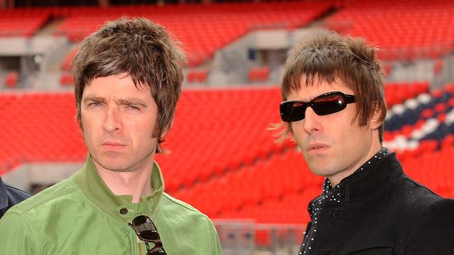 LONDON, ENGLAND - OCTOBER 16:  Noel Gallagher (left) and Liam Gallagher of Oasis pose at Wembley Stadium on October 16, 2008 in London, England. (Photo by Samir Hussein/Getty Images)