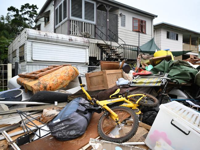 MURWILLUMBAH, AUSTRALIA - MARCH 11: Flood-damaged items and debris are seen outside a house on March 11, 2022 in Murwillumbah, Australia. Residents across the NSW Northern Rivers areas are assessing the damage and losses as floodwaters recede. The area is now facing a housing crisis as thousands of homes have been left uninhabitable following the floods. (Photo by Dan Peled/Getty Images)