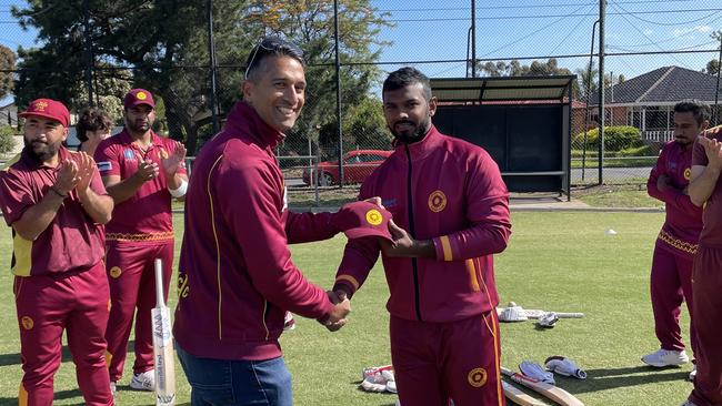 Sunshine Heights president Walter Saldanha presenting Sameera Sadamal with his cap. (Picture: Supplied)