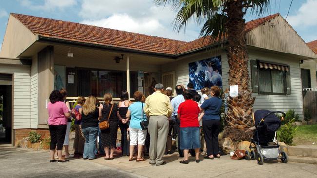 People still queue to view the weeping walls in the “Miracle House”.